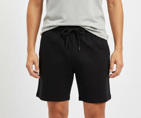 Versatile men’s athletic shorts in breathable cotton, available in black and grey, designed for gym, swim, or casual loungewear