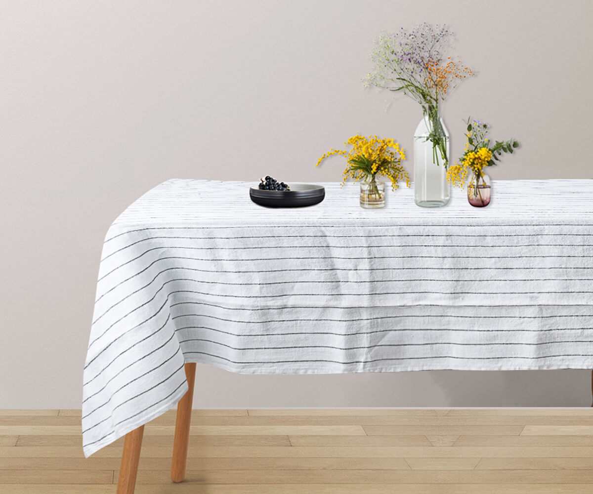 A french linen tablecloth specifically designed for a 6-foot table.