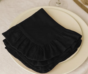 Set of 100% cotton black ruffled edge napkins, absorbent and stylish fabric dinner napkins available in multiple sizes, perfect for rustic, modern, and formal dining tablescapes.