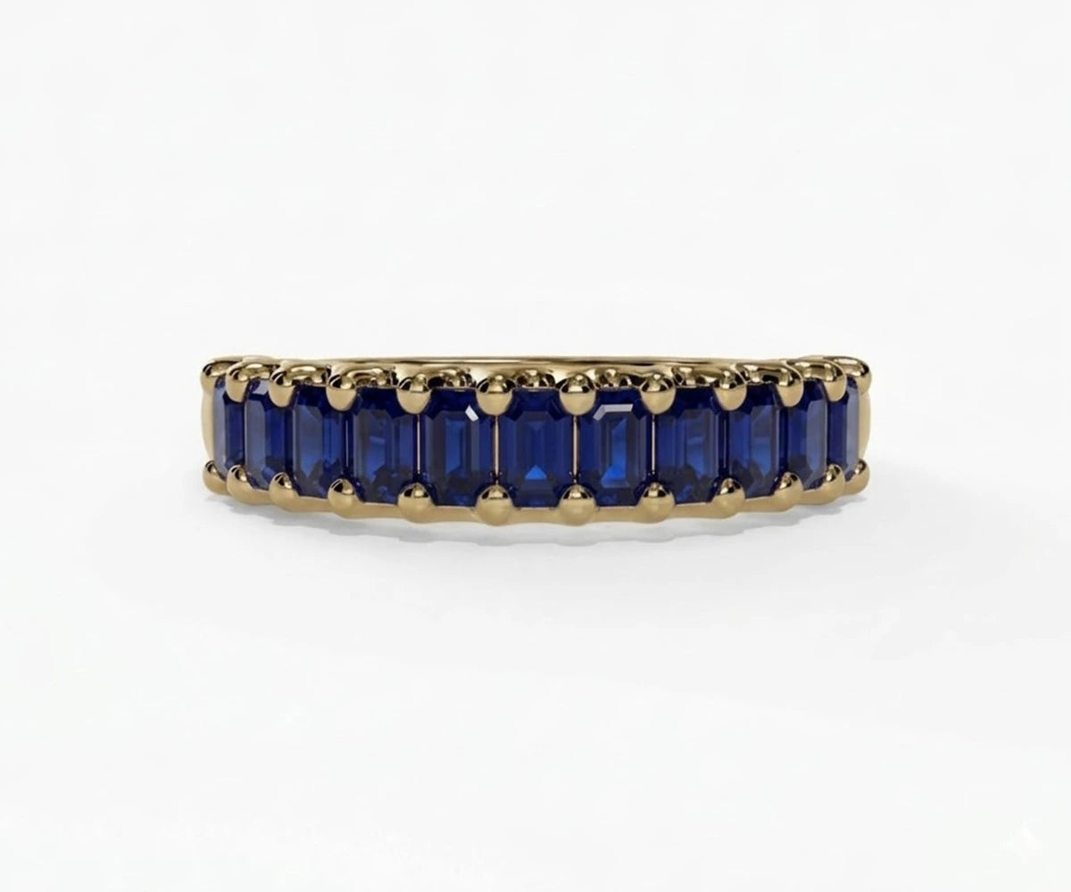 Fine jewelry lab grown sapphire ring with vibrant blue baguette stones