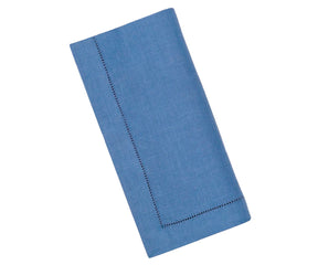 Elegant blue hemstitched linen napkins placed on a table setting – 100% pure linen for refined dining.
