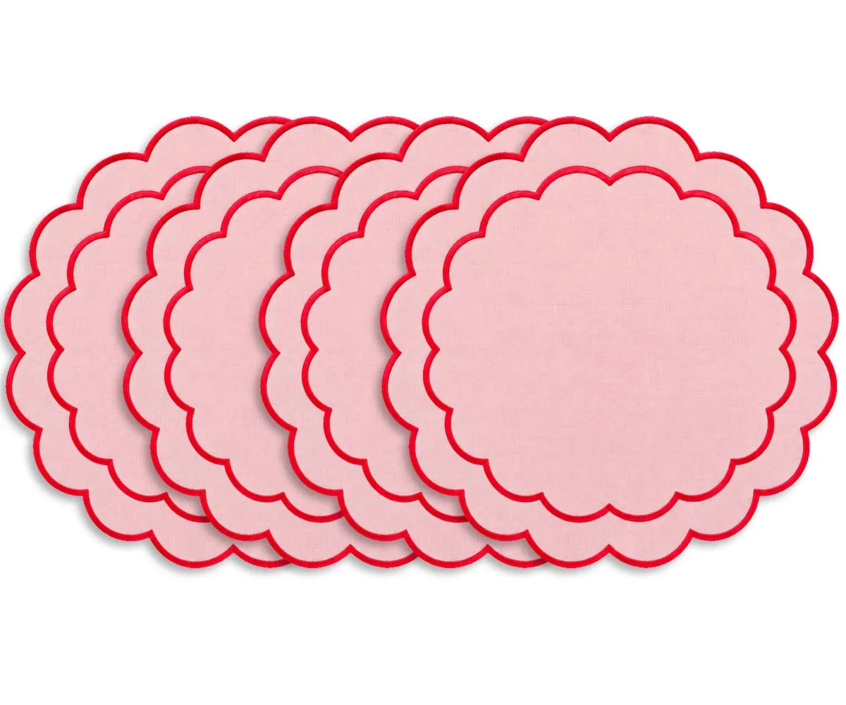 Round cotton placemat featuring a delicate scalloped edge and embroidered detailing for an elegant dining table setting