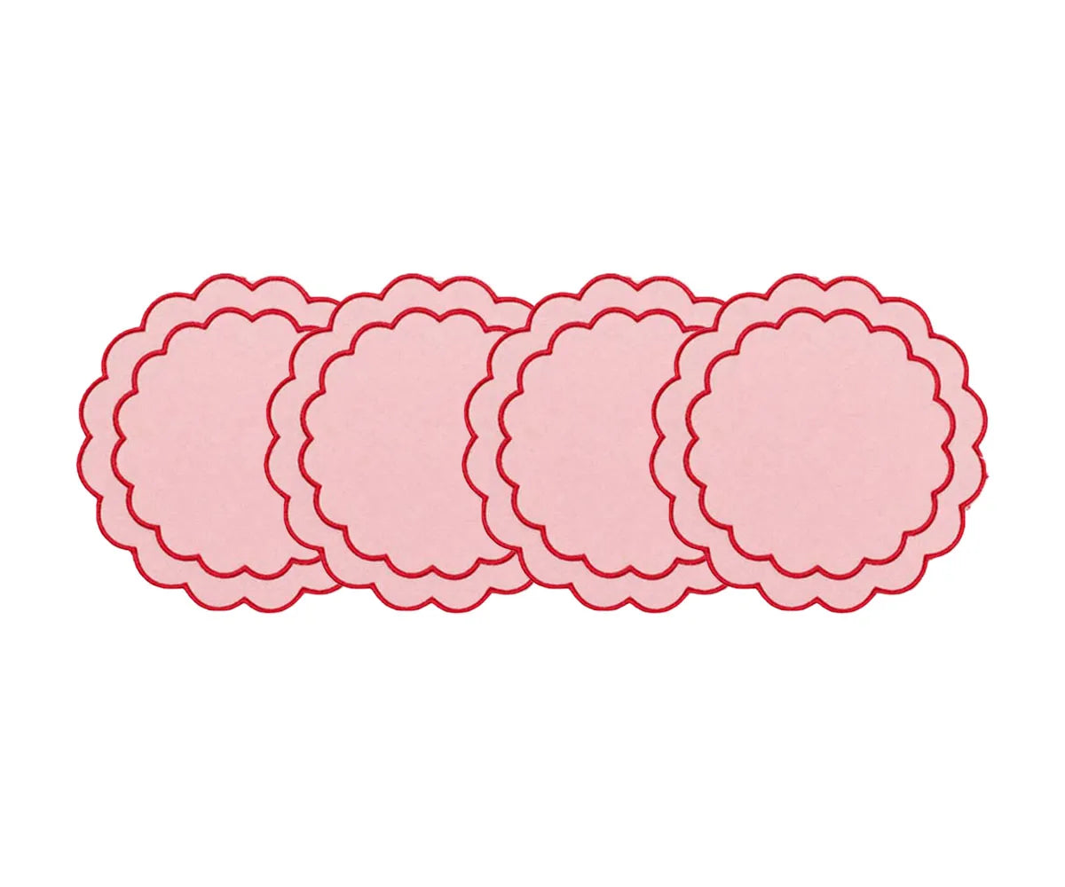 Round cotton placemats with scalloped edges and embroidered detailing for elegant dining table décor
