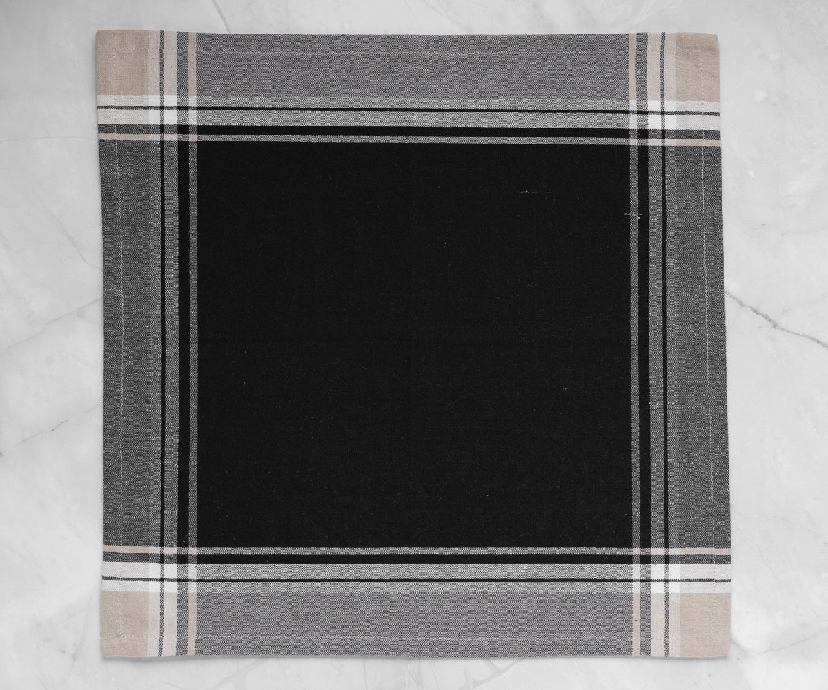 Luxurious black cloth stripe napkins adding a touch of elegance to a special occasion.