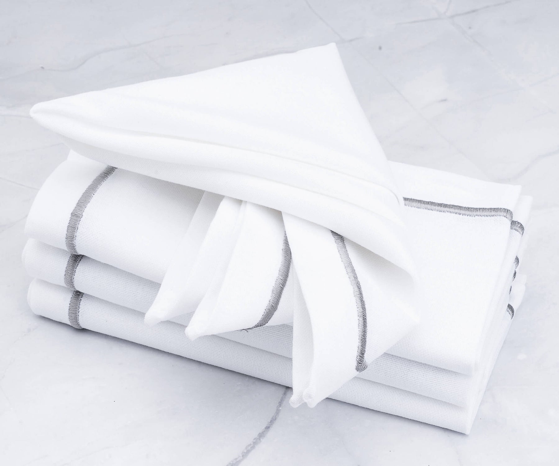 Set your table with soft gray napkins, adding a natural touch.