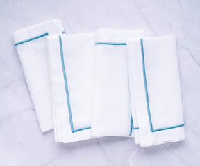 A stack of elegant blue cloth napkins, perfect for any occasion.