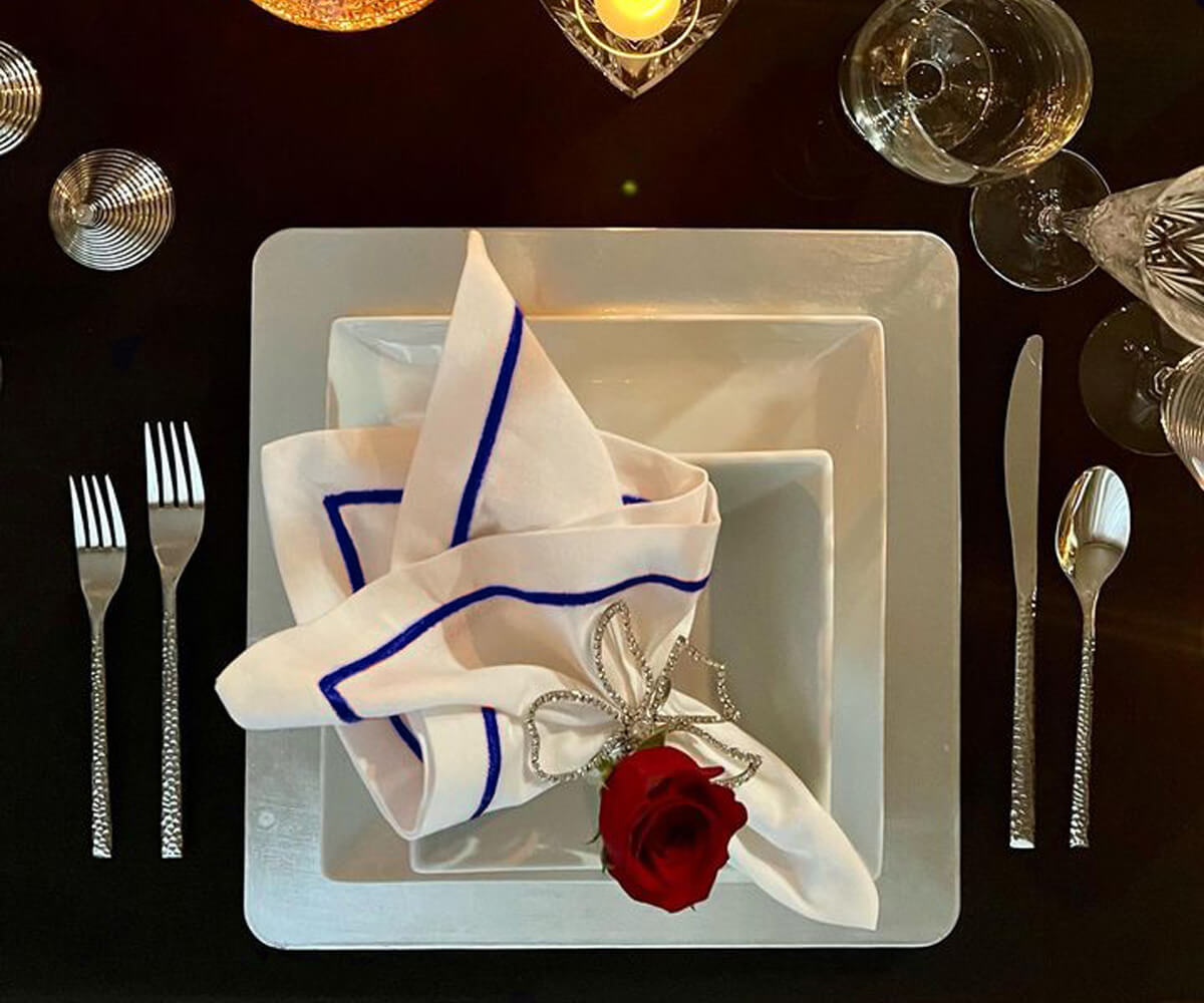 Dusty blue napkins, evoking a sense of tranquility and elegance.