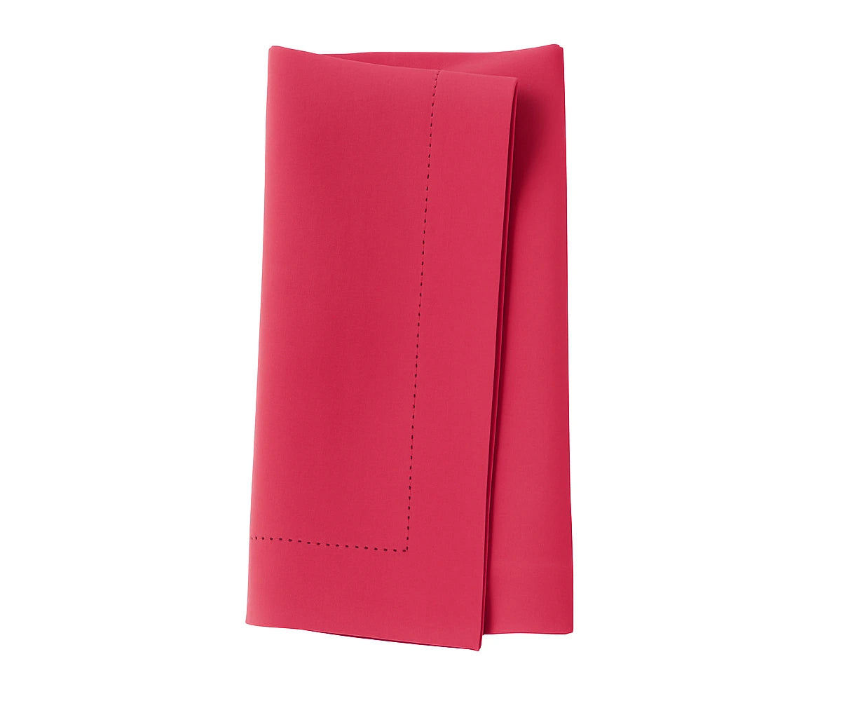 Coral cotton napkin with a fresh, lively shade adding warmth to dining décor.