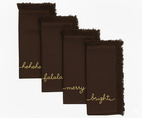 Brown cotton fringe napkins embroidered in gold with Ho Ho Ho, Fa La La, Merry & Bright – rustic Christmas décor