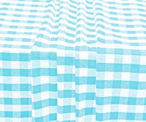 Farmhouse tablecloth with gingham accents, adding warmth to your home.