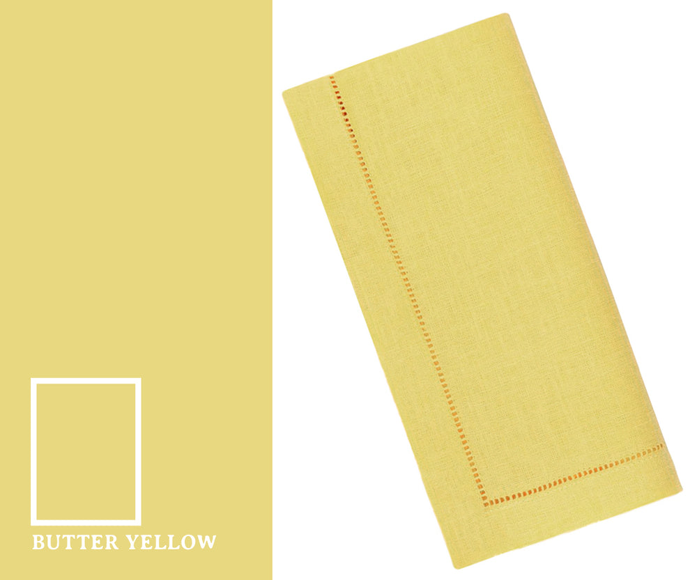 Butter yellow napkins neatly folded for an elegant dining table setting, perfect for everyday meals, parties, or special occasions.