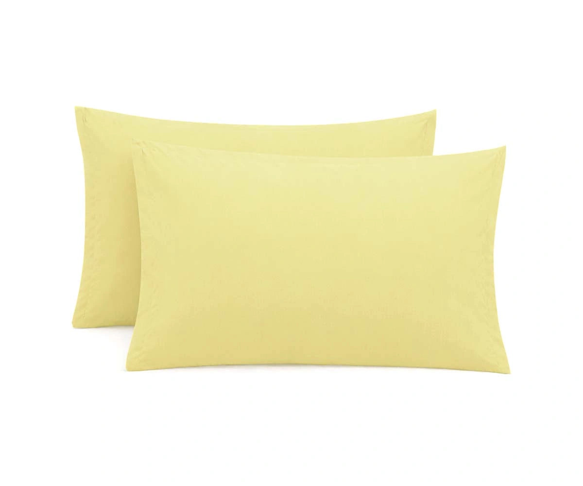 Butter yellow cotton pillowcase with soft, warm pastel tone for cozy bedroom styling