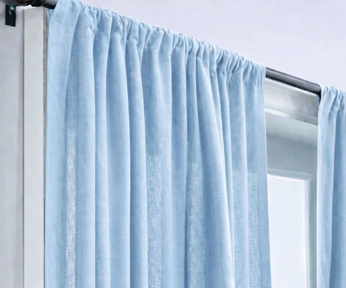 Elegant sky blue linen curtains for living rooms, designed to enhance natural daylight while offering relaxed privacy and timeless style.