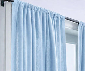 Elegant sky blue linen curtains for living rooms, designed to enhance natural daylight while offering relaxed privacy and timeless style.