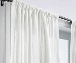 Classic white linen curtains designed to enhance natural light, creating a fresh, open living room feel with breathable, high-quality linen fabric.