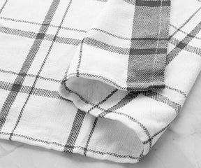 Plaid kitchen towels in neutral tones for a versatile kitchen accessory.