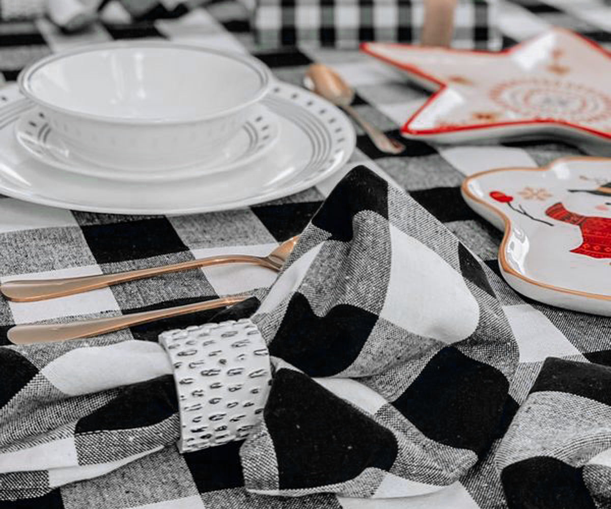Elevate table decor with stylish black and white napkins, adding a touch of sophistication to any setting.