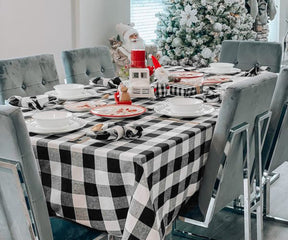 Festive table setting featuring a black checkered tablecloth for Christmas