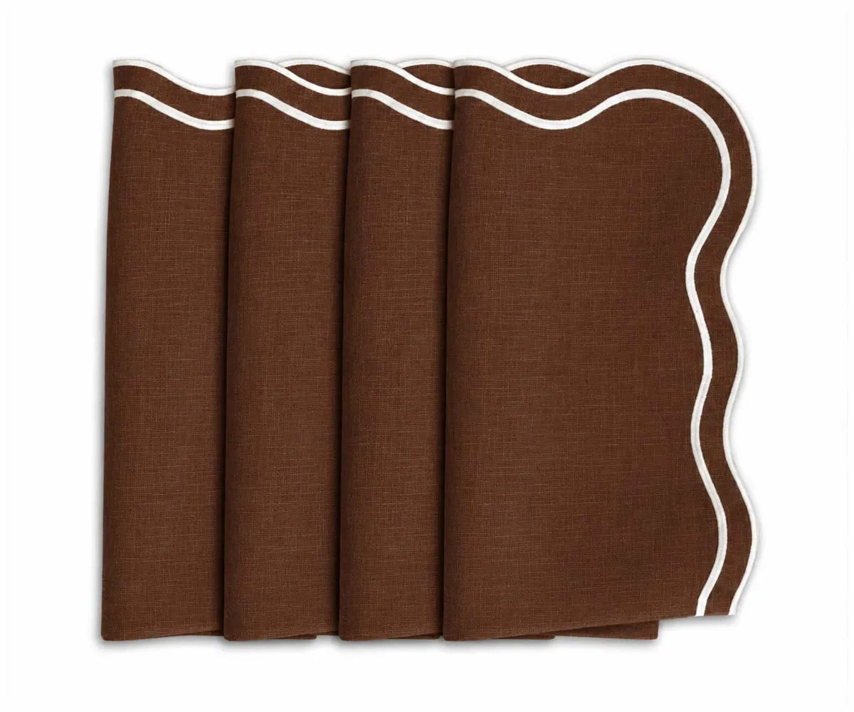 Set of four chocolate brown dinner napkins featuring contrasting white scalloped embroidered borders