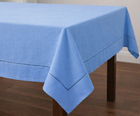 Solid blue cotton tablecloth with stitched hem