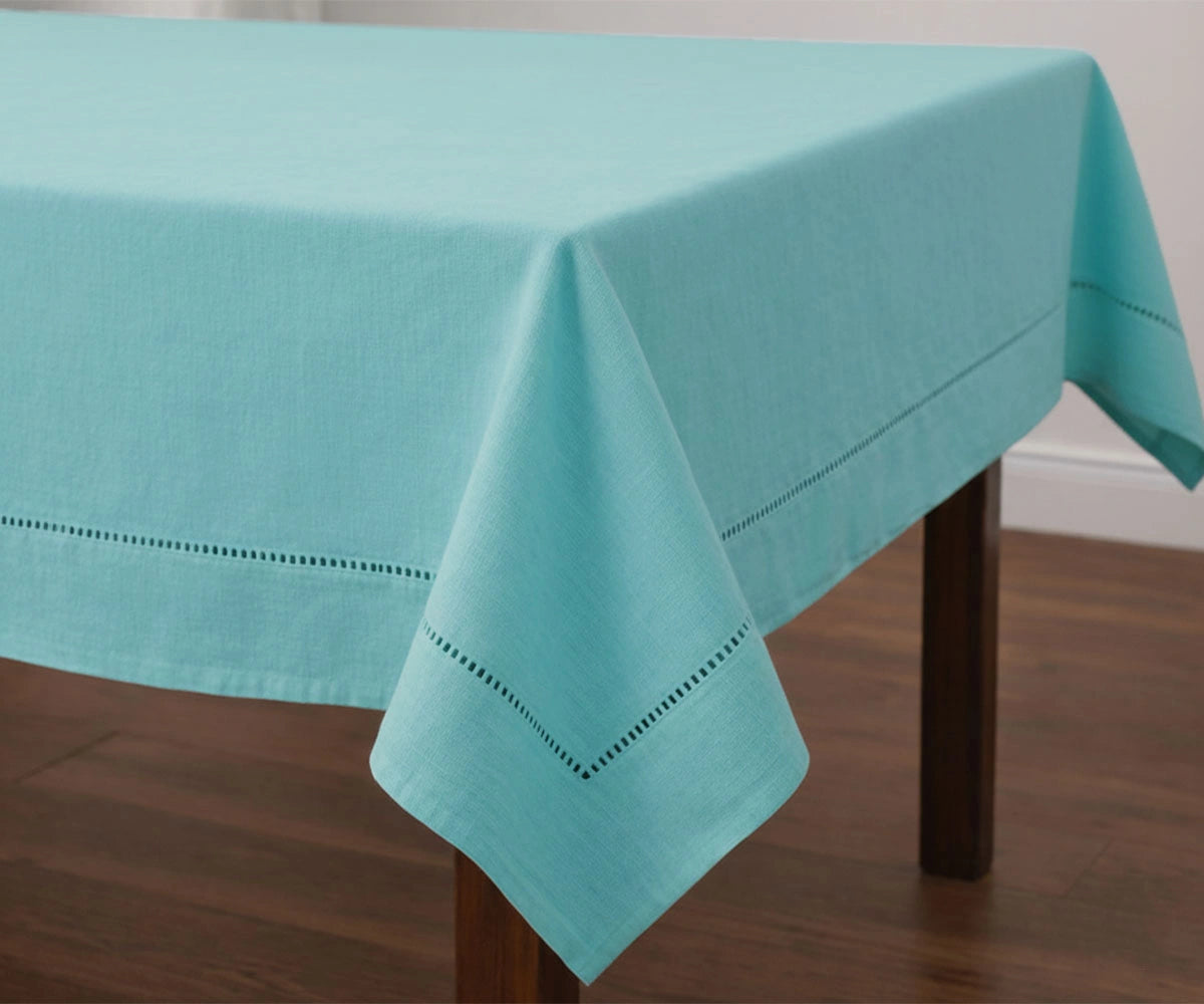 Solid pastelturquiose cotton tablecloth with stitched hem