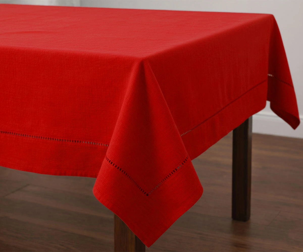 Solid red cotton tablecloth with stitched hem