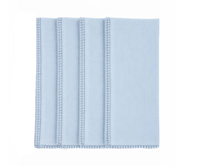 Light blue cotton napkin with pom pom edge detail