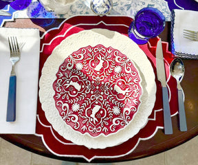 Scalloped red placemats with a modern twist for round tables"