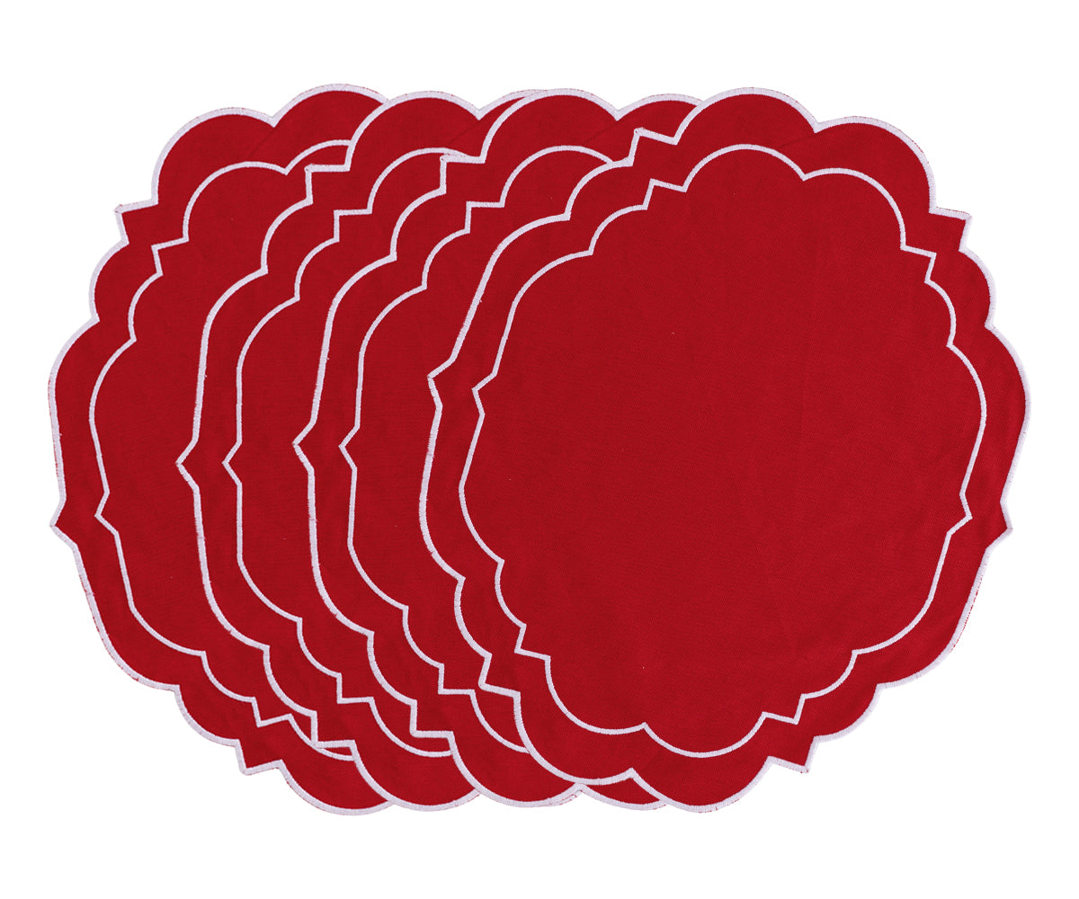 Red placemats with scalloped edges for round dining tables