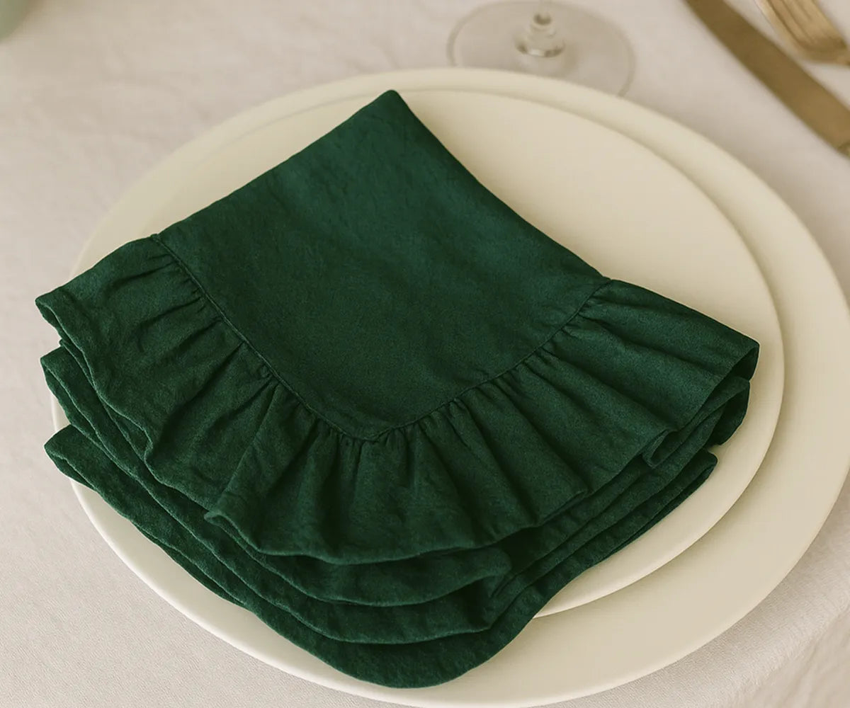 Elegant Evergreen cotton napkins paired with matching ruffled tablecloth for a sophisticated farmhouse tablescape