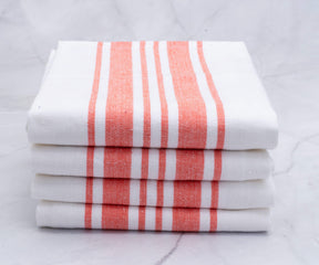 Stack of kitchen towels with alternating white and red stripes