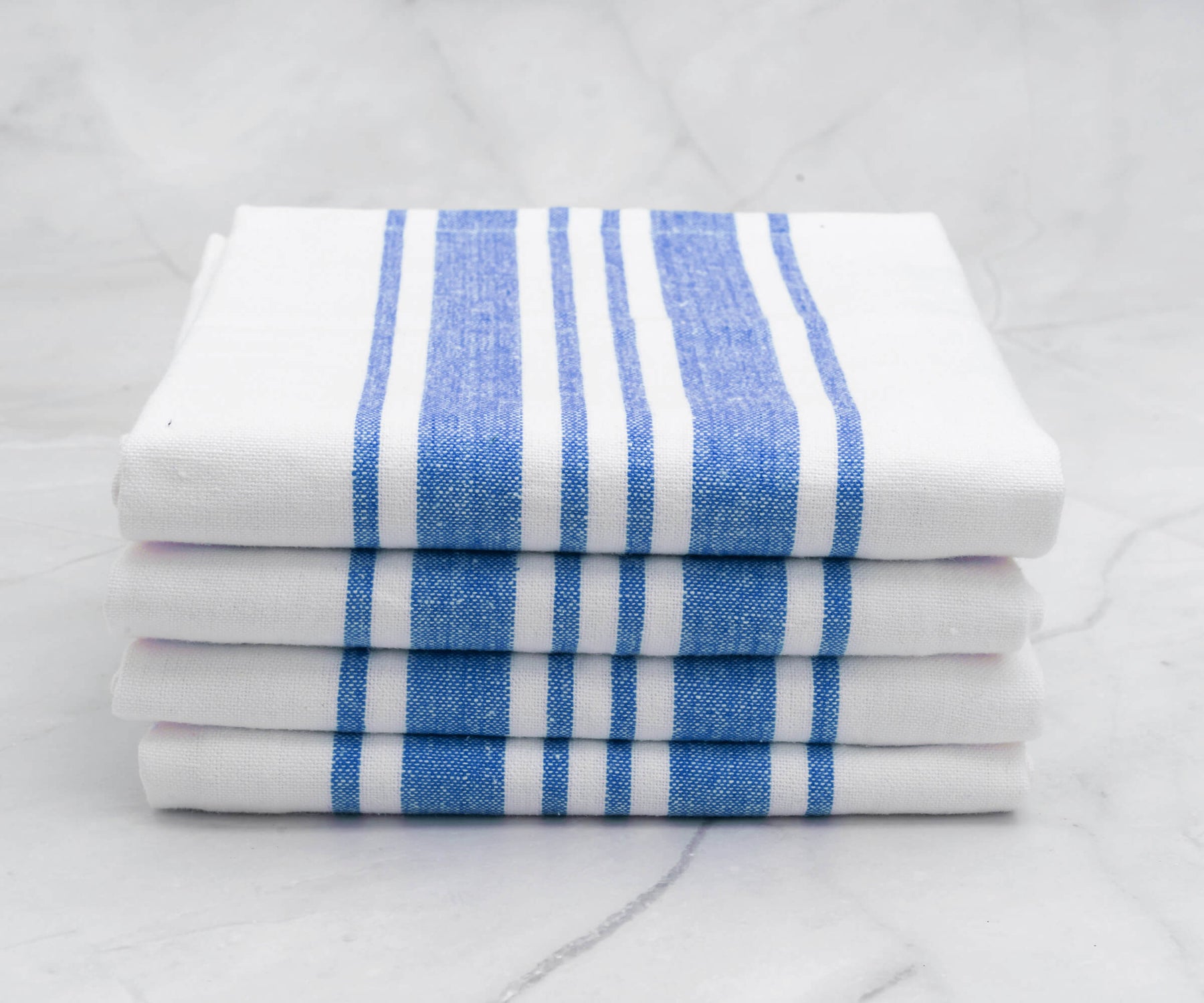 Pile of four kitchen towels, each with blue and white stripes