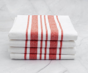 Stack of kitchen towels with alternating white and red stripes