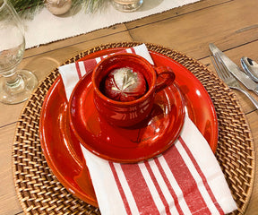 Red and white striped napkins adding a touch of color to a holiday table.