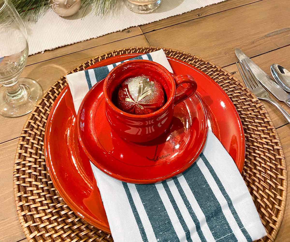 Green cloth napkins arranged neatly, adding a pop of color to the table.