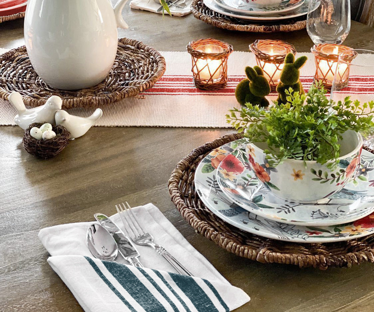 Green napkins, offering a subtle and natural touch to the dining table.