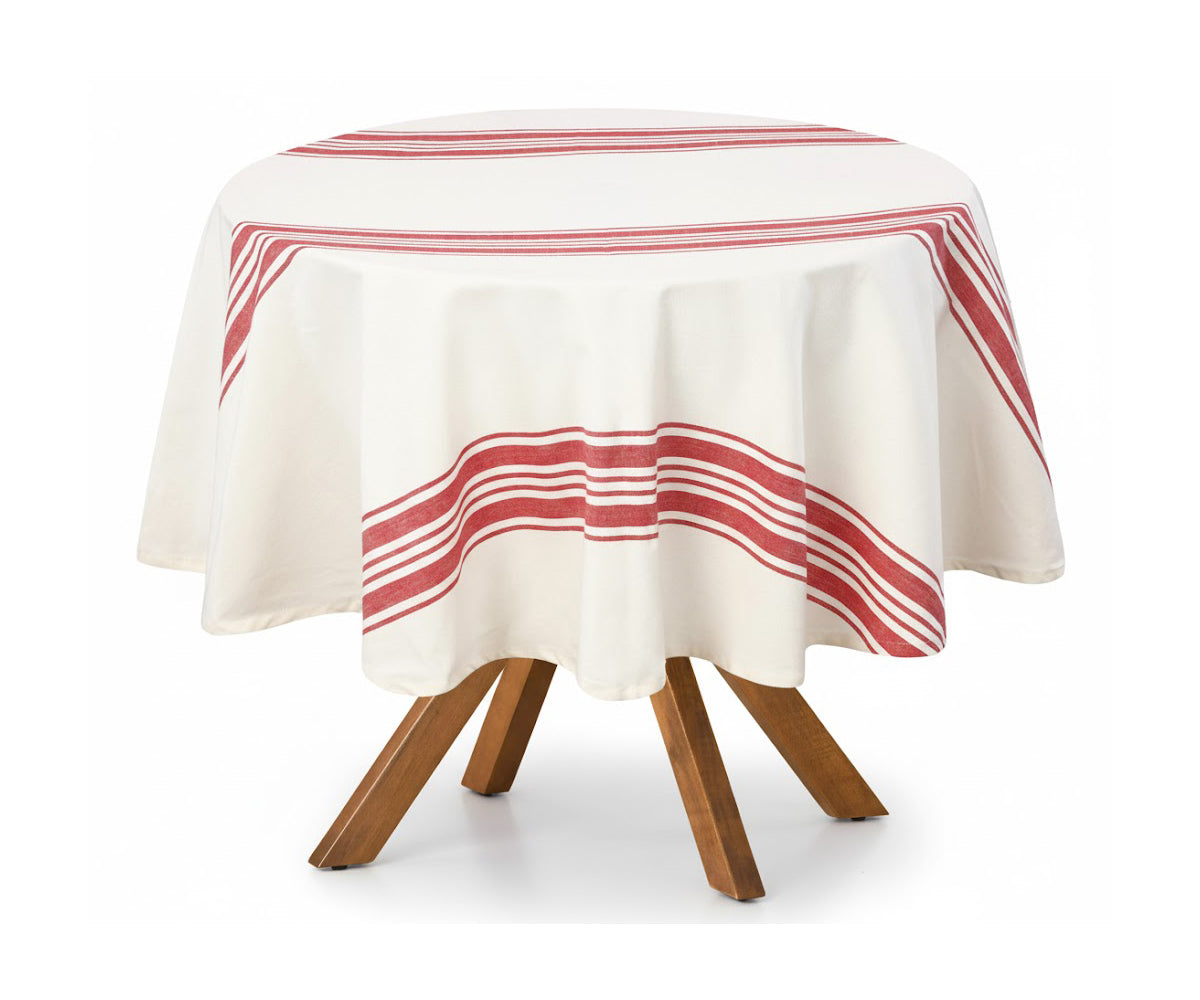 Small table with a red and white striped tablecloth on a white background