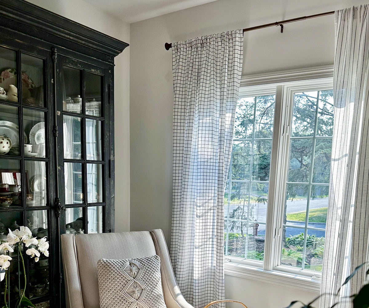 White 100% linen curtains with subtle stripe detail, styled in a bright living room