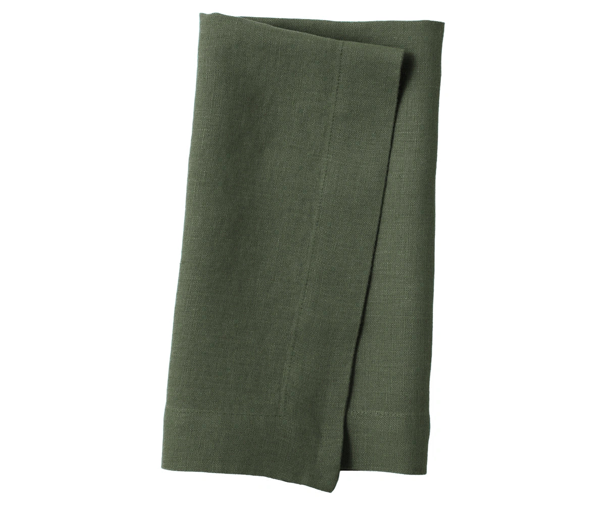 Cypress green plain linen napkin neatly placed, highlighting eco-friendly linen fabric