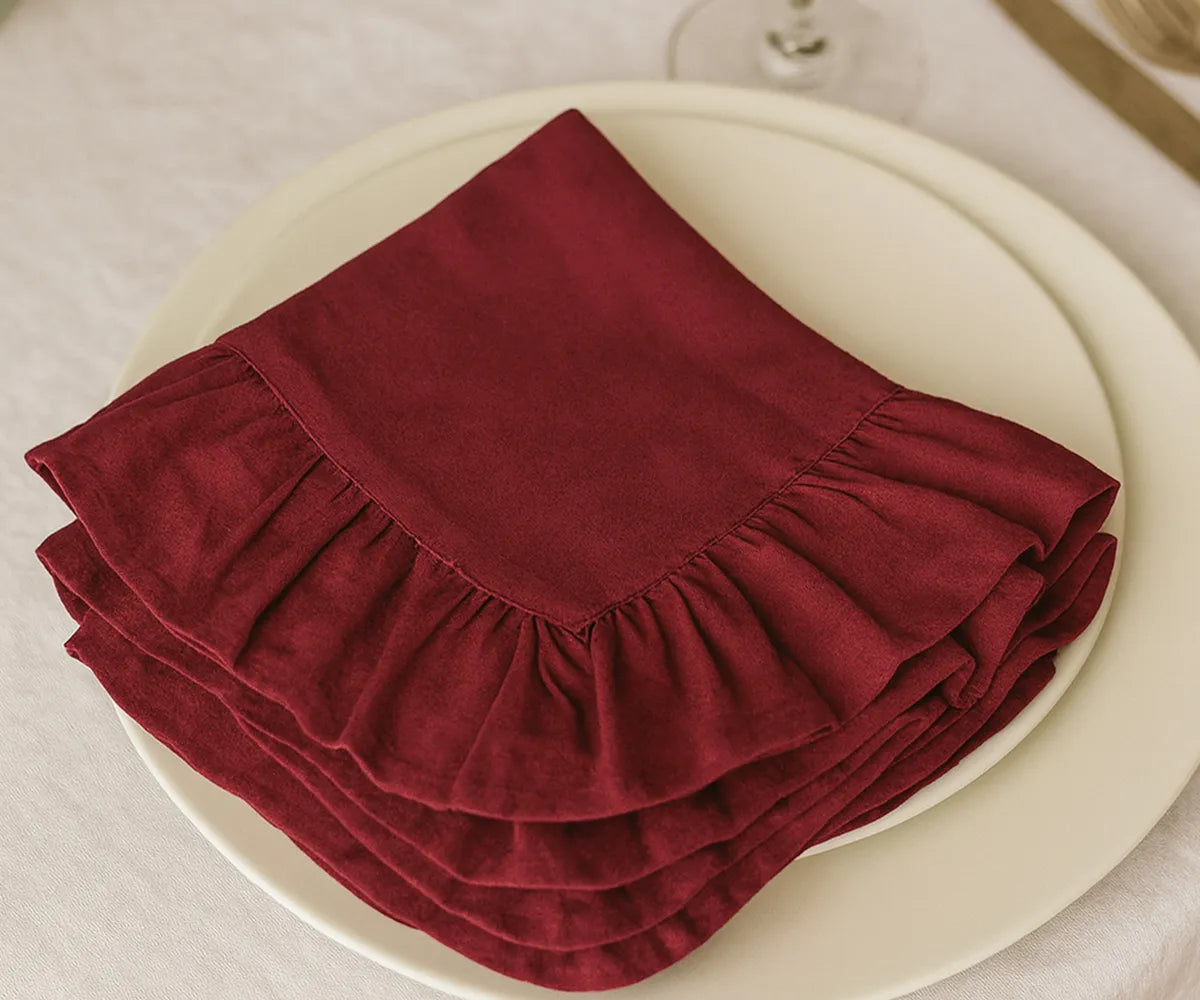 Set of decorative dark red ruffled cloth napkins made from 100% cotton, washable and eco-friendly fabric napkins available in multiple sizes, perfect for everyday meals and special occasions.
