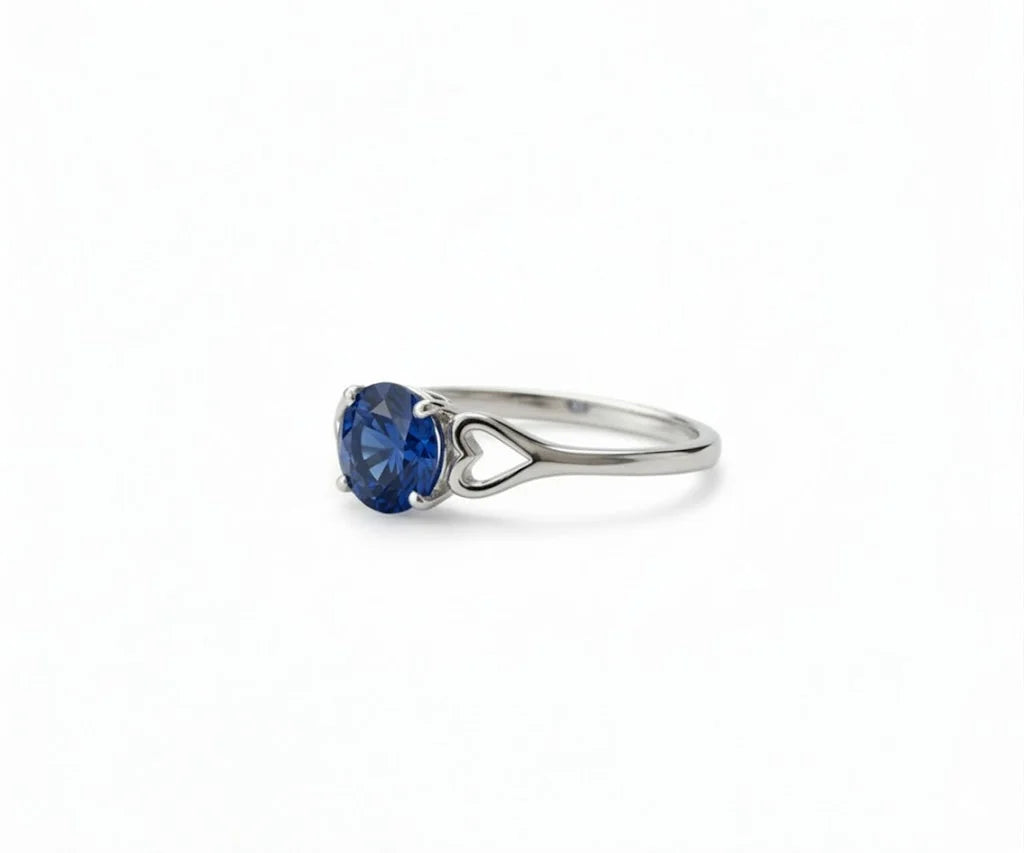 sapphire ring in silver with deep blue gemstone