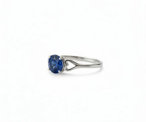 sapphire ring in silver with deep blue gemstone