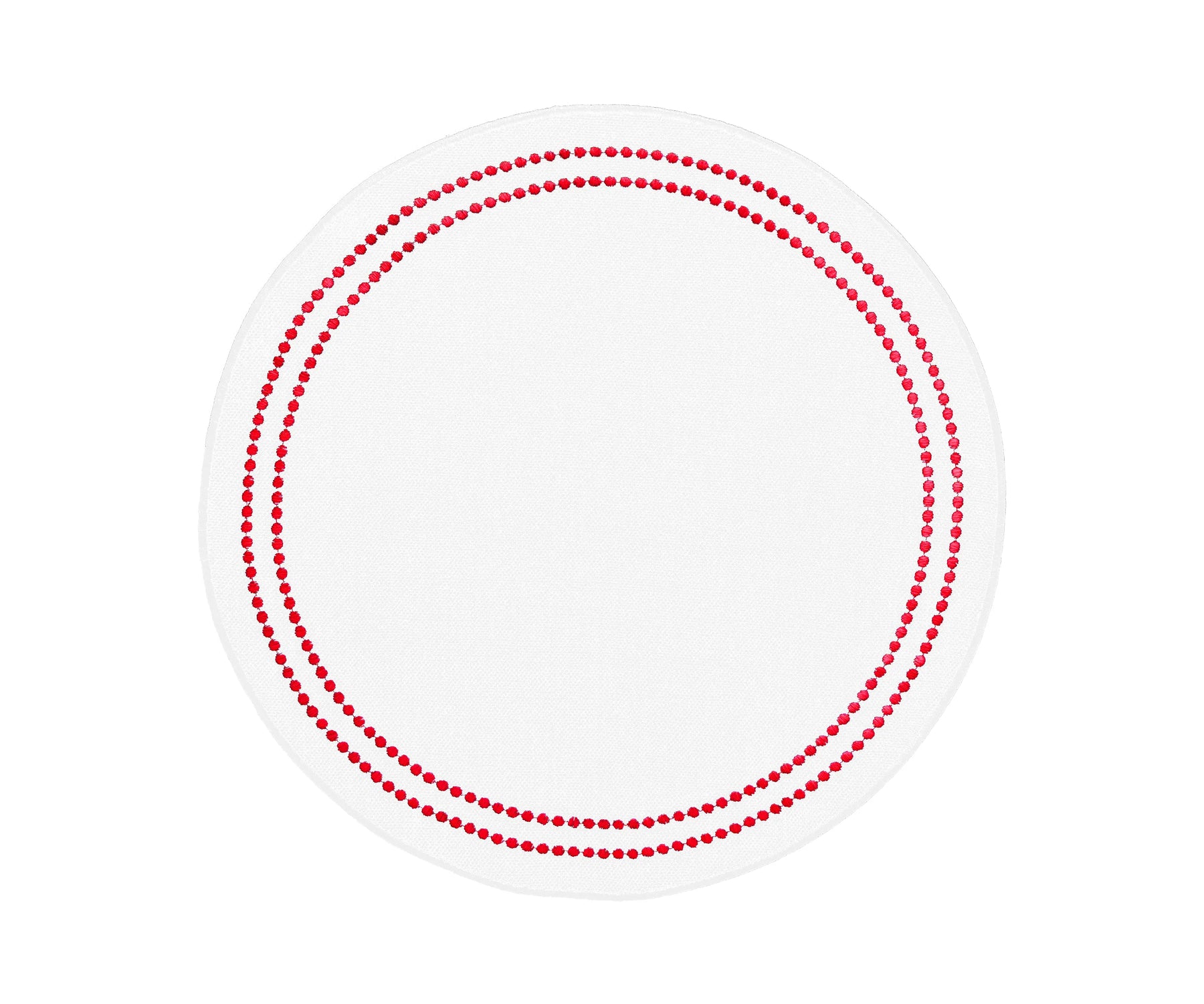 Red and white round cotton placemat with embroidered pearl design on dining table