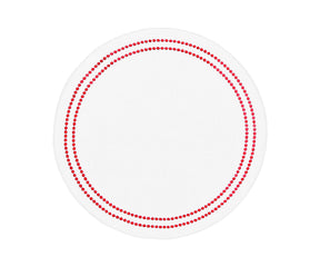 Red and white round cotton placemat with embroidered pearl design on dining table