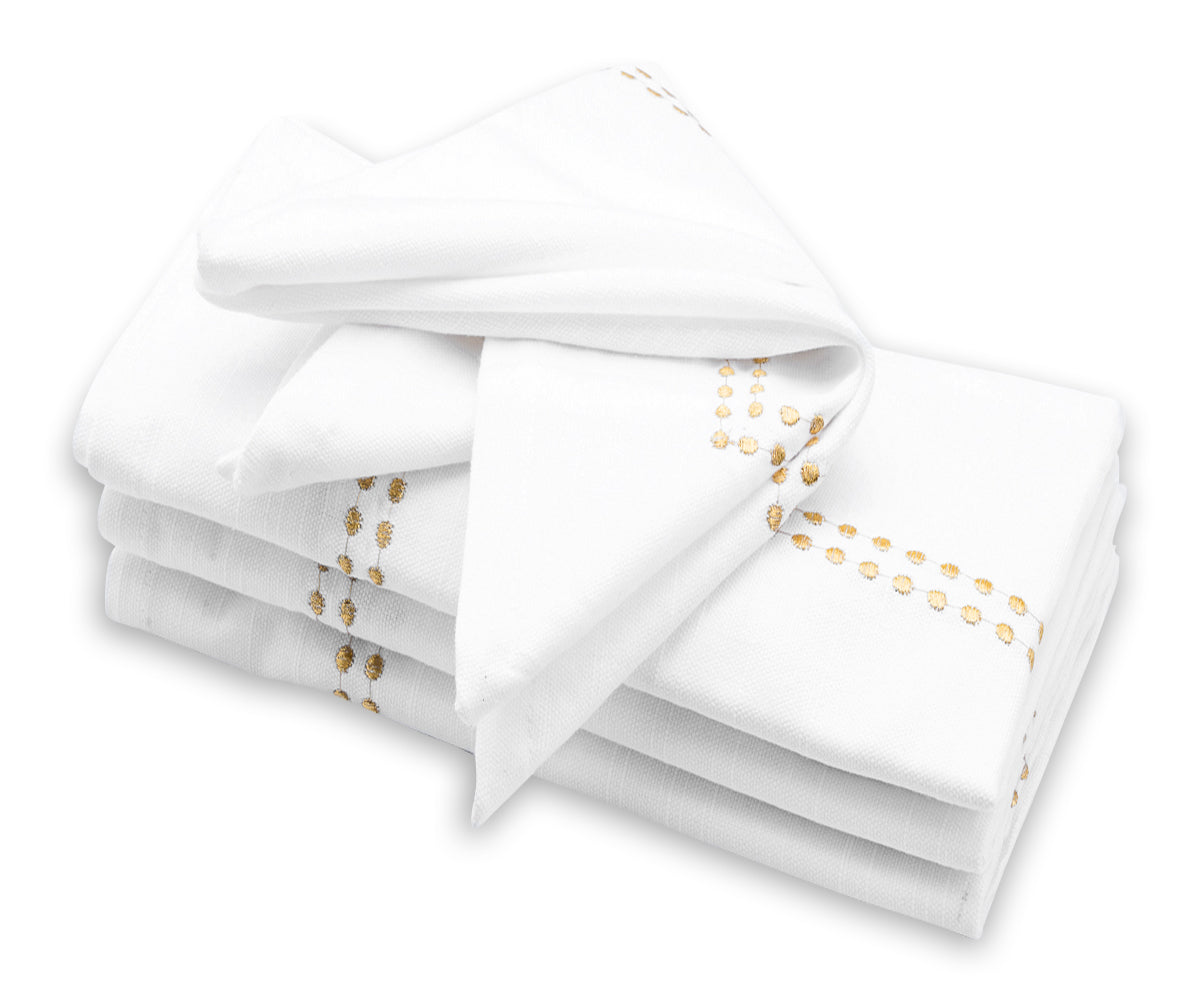 Dinner Napkins Pile of Shimmering Gold Napkins on a Buffet Table | All Cotton And Linen