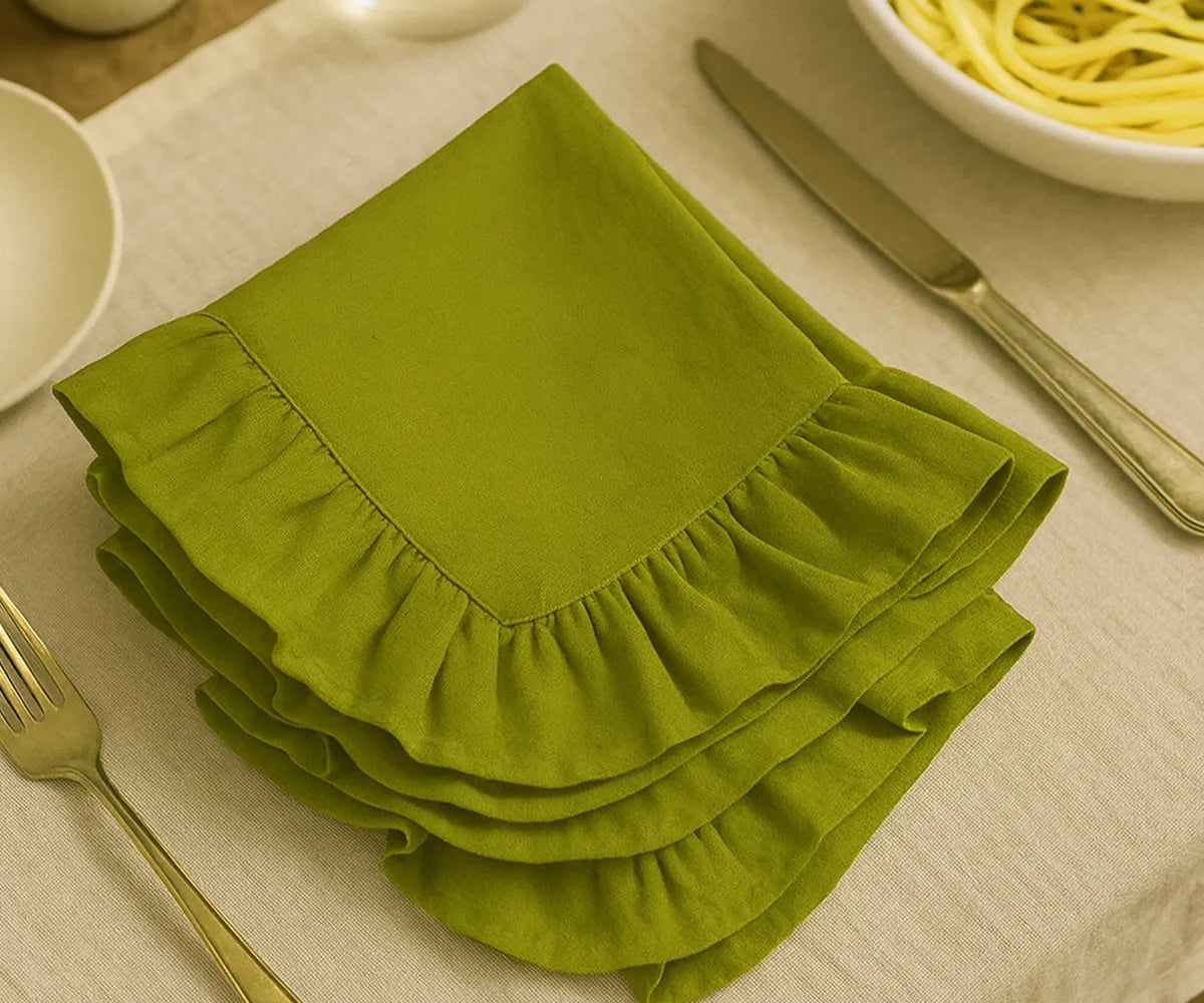 Earthy green cotton ruffle edge dinner napkins, reusable and washable cloth napkins for weddings, garden parties, family meals, and rustic farmhouse table décor.