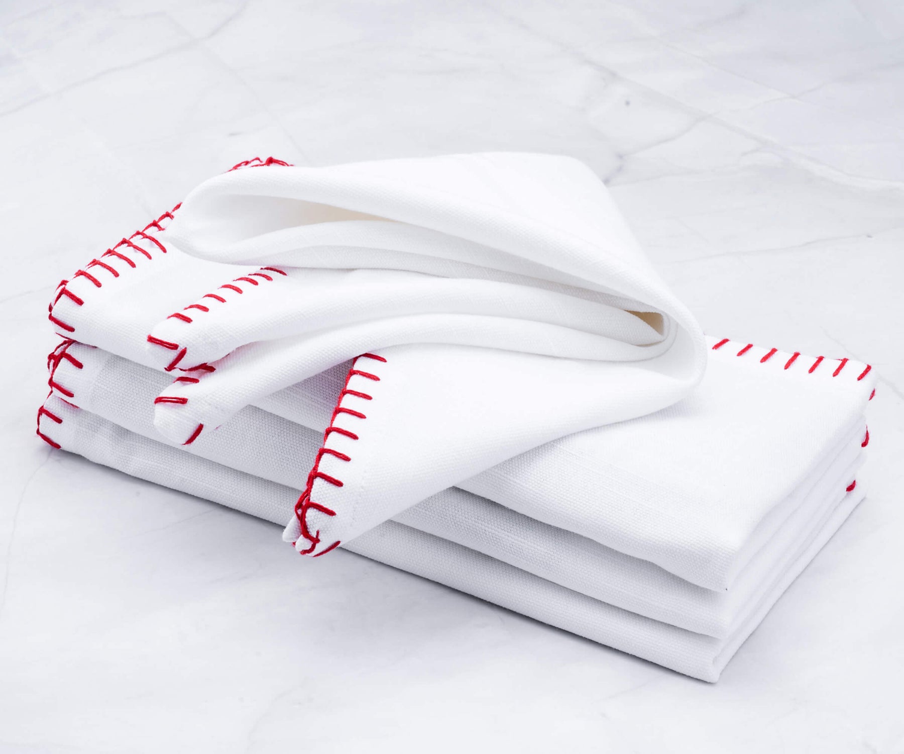 Collection of shell edge napkins with red embroidery, mistaken for towels