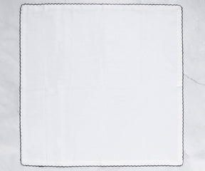 Single shell edge cloth napkin with a sophisticated black border