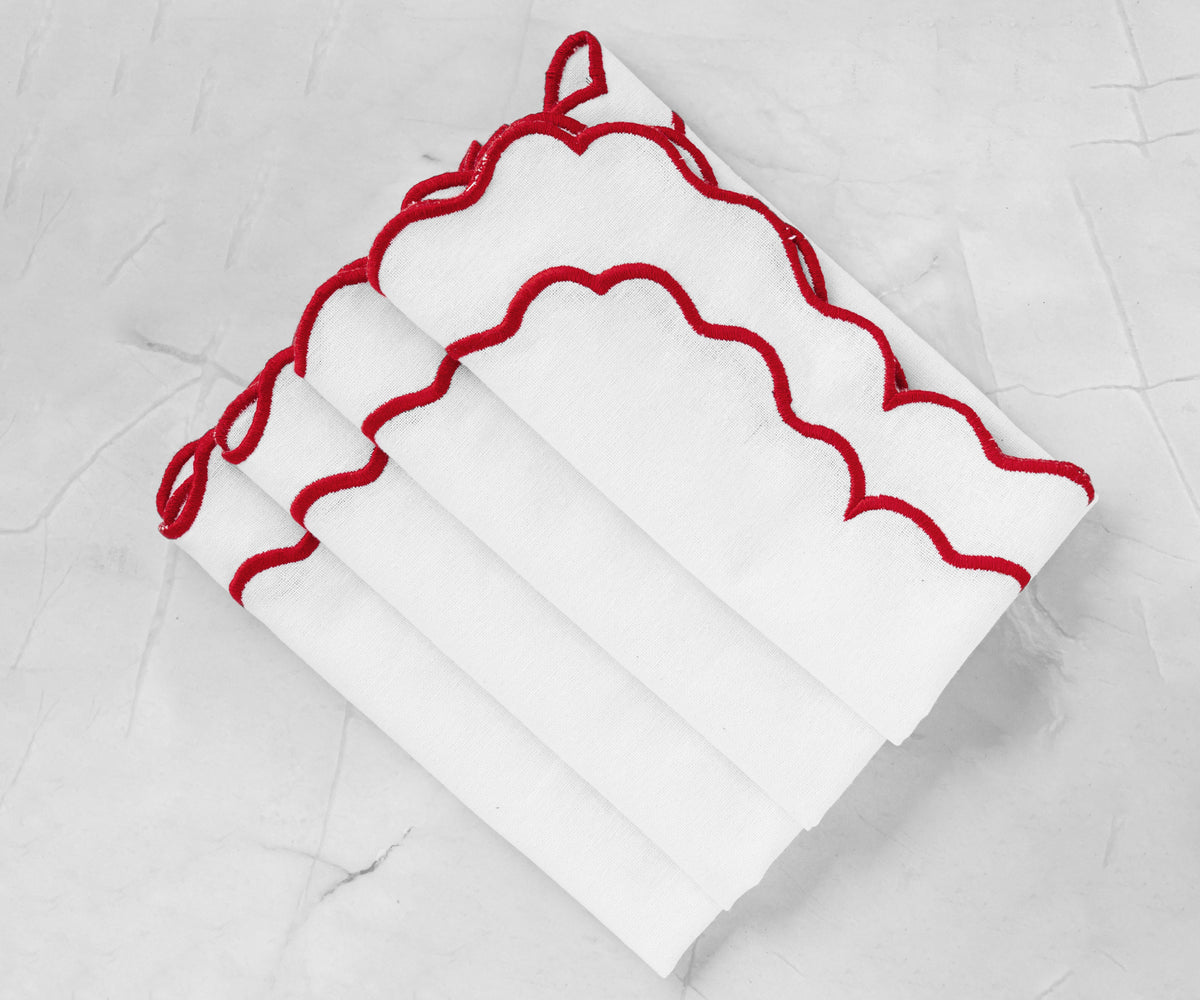 Elegant white scalloped napkin with finely embroidered edges