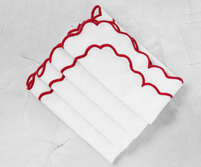 Elegant white scalloped napkin with finely embroidered edges